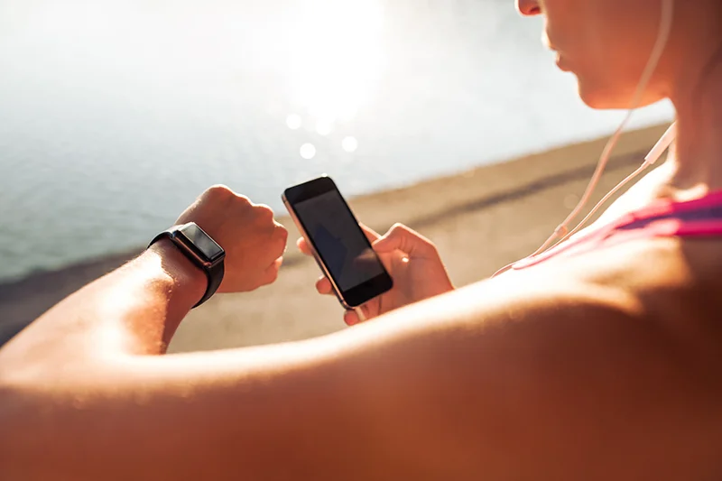 Sportswoman using smart devices